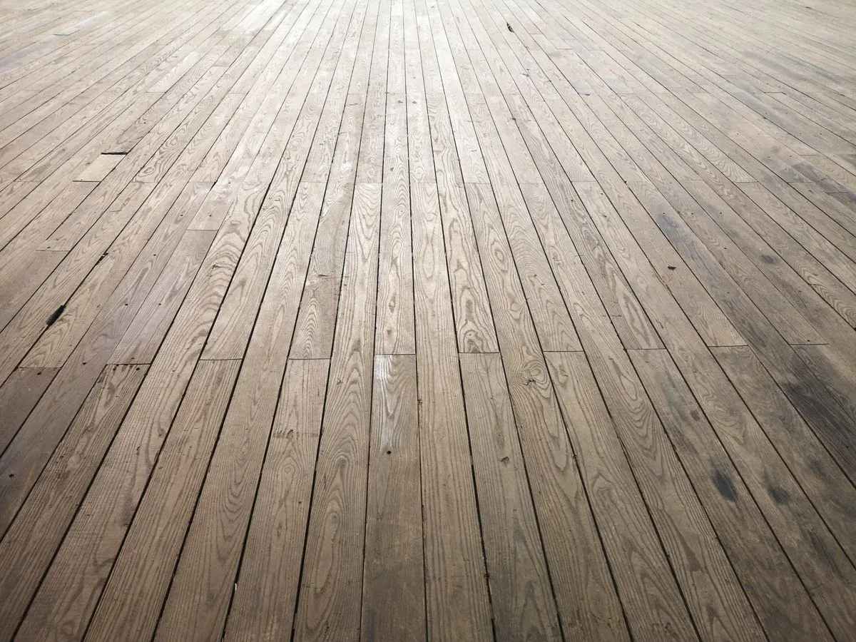Clean wooden deck boards in good condition after professional wood-safe cleaning