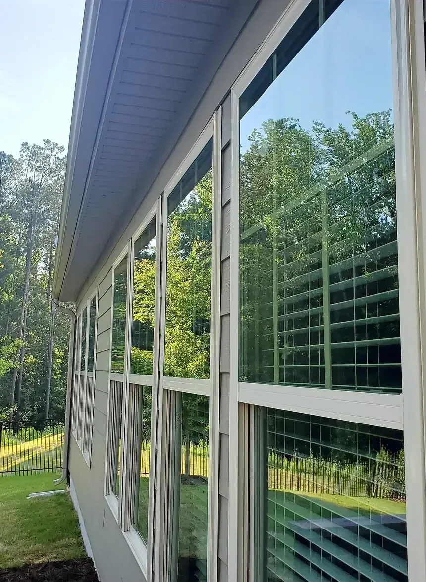 Exterior windows of a home professionally cleaned with pure water, glass and frames spot-free